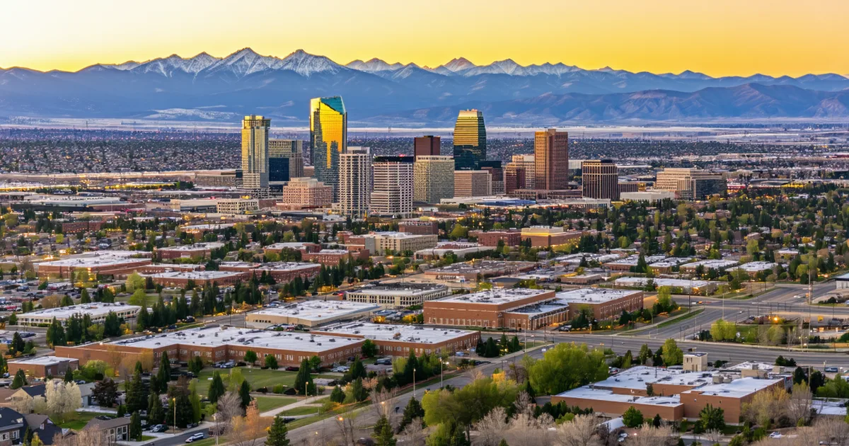 Aerial view of Salt Lake City industrial district at dusk with mountain backdrop